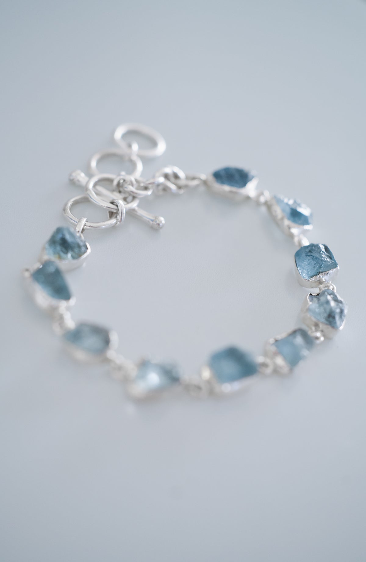 Rustic Stone Bracelet in aquamarine, photographed at an angle