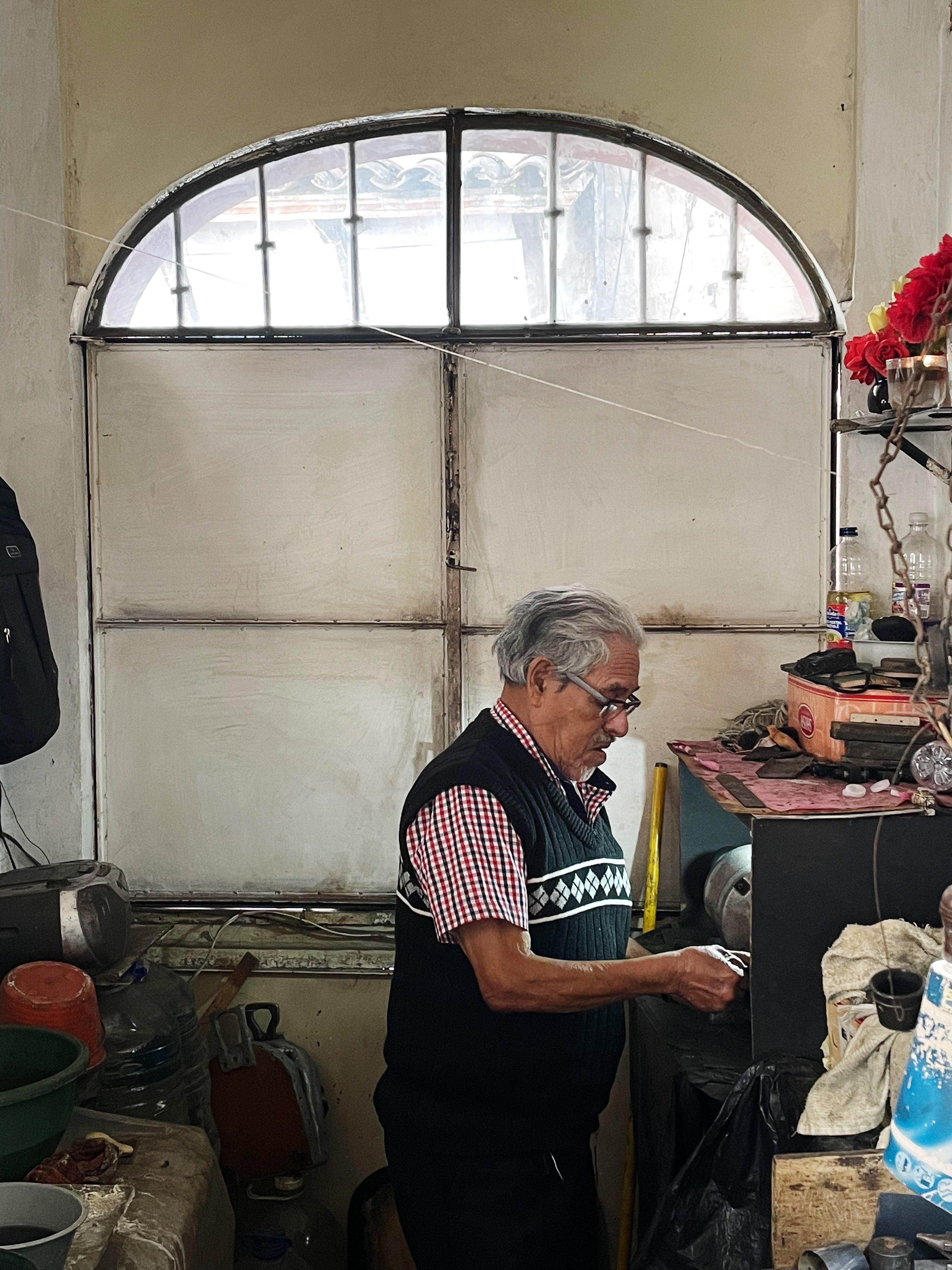 Silversmith working at a bench